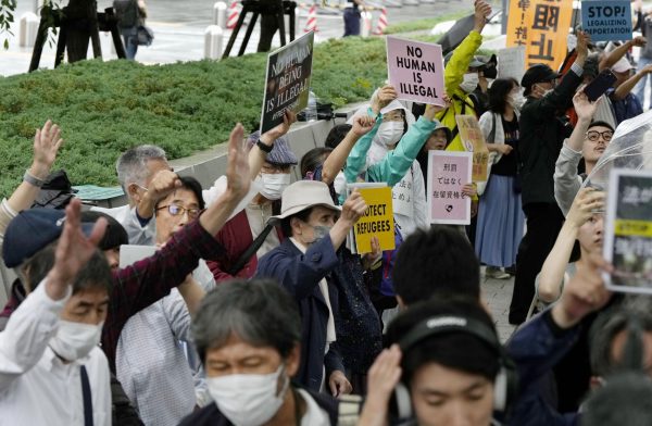 People gather in front of the Diet building in Tokyo to protest against parliament's passage of a bill to revise an immigration laws, Tokyo, Japan, 9 June 2023 (Photo: Reuters).
